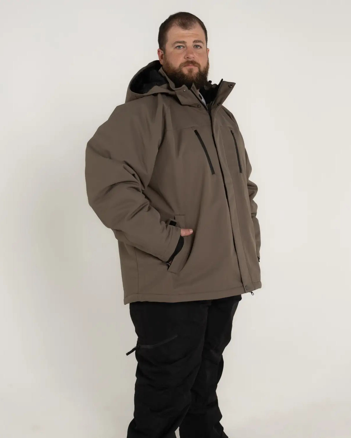 Man wearing Snow Country Outerwear Siberian III insulated winter soft shell jacket in big sizes