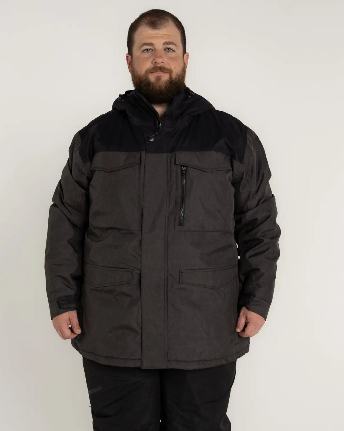 Man wearing a gray and black insulated winter parka from Snow Country Outerwear Men’s Big Sizes