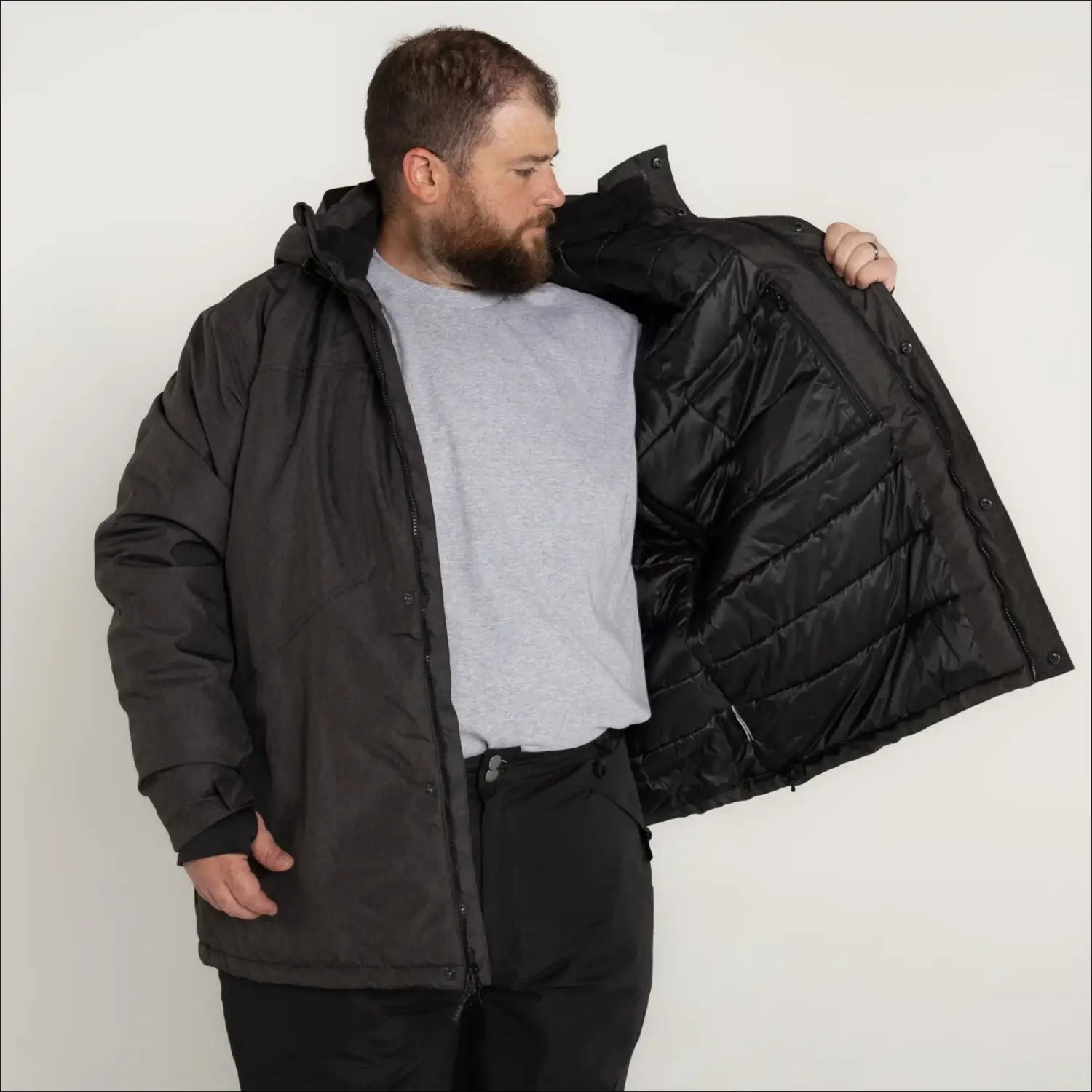 Man in open black insulated winter snow ski jacket coat outdoor outerwear