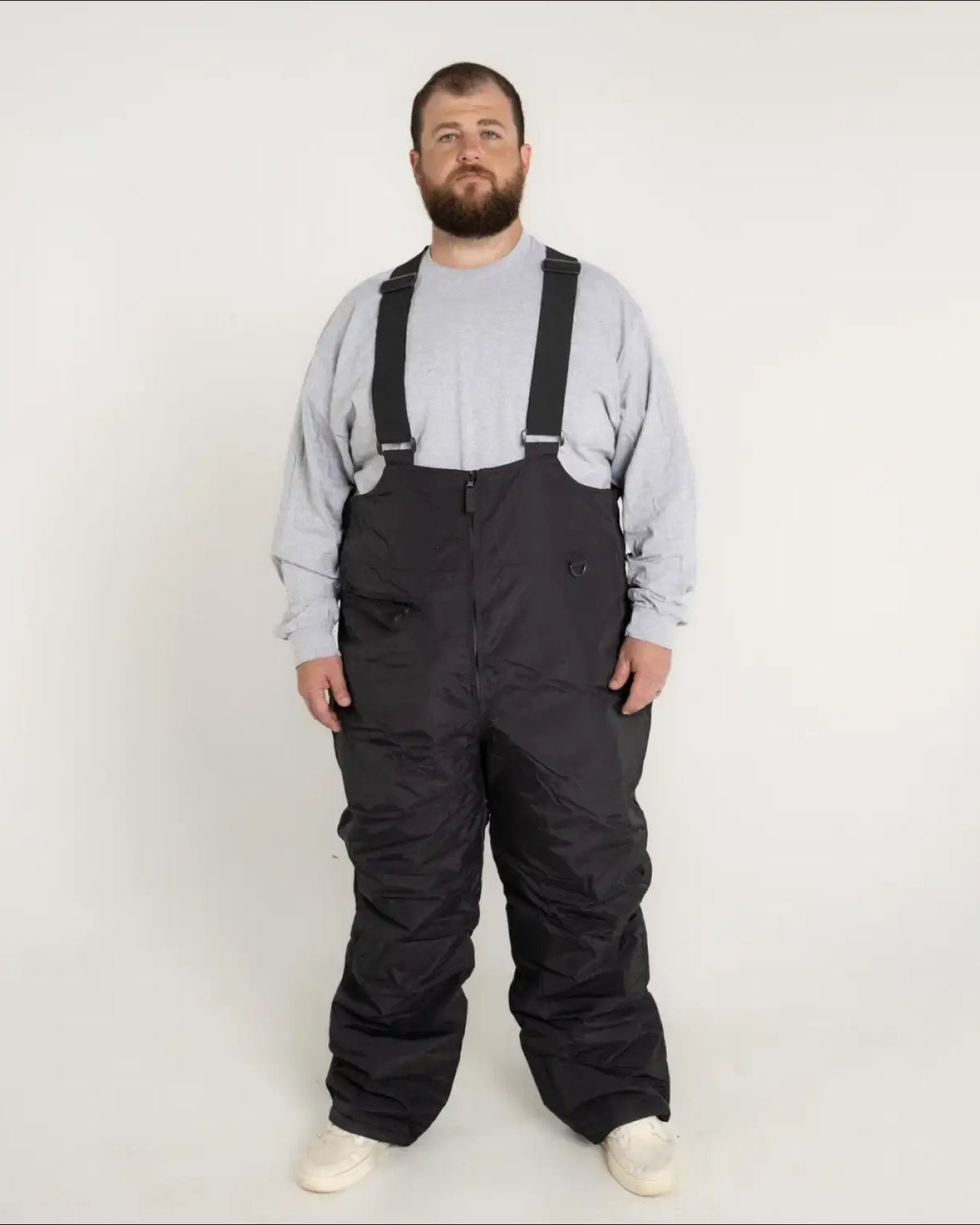 Black snow pants with suspenders from Snow Country Outerwear Mens Ski Bibs