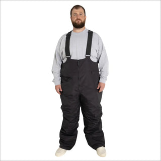 Man wearing black Snow Country Outerwear insulated ski snow bibs with suspenders