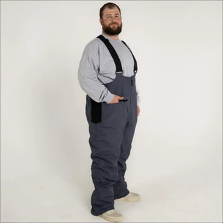Man in gray Snow Country insulated ski snow bibs with suspenders for big and tall sizes