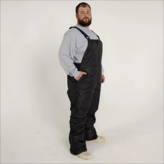 Black insulated bib overalls for men from Snow Country Outerwear, perfect for winter skiing