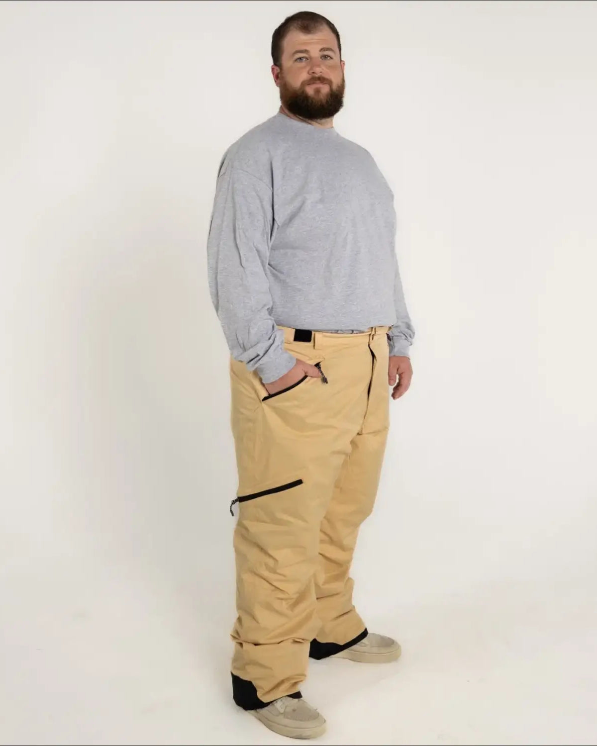 Man wearing tan Snow Country insulated winter ski snow pants for men