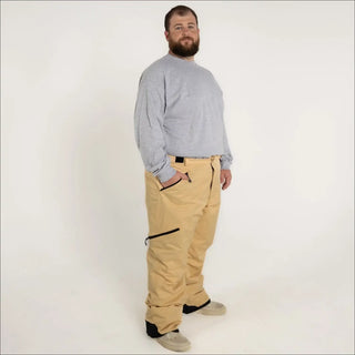 Man wearing tan Snow Country insulated winter ski snow pants for men