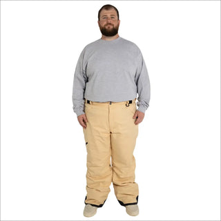 Man wearing tan snow pants and gray shirt in Snow Country Outerwear ski gear