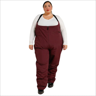 Woman wearing burgundy Snow Country Outerwear plus size winter snow ski bibs