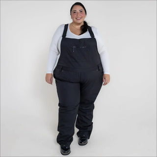 Black plus-size snow bib overalls for women in the 1X-6X Soft Shell Stretch Ski Bibs Pants collection