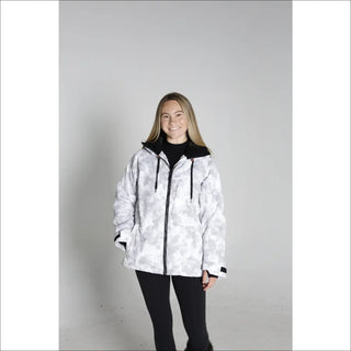 Woman wearing a white and gray camouflage Snow Country Women’s Ski Coat for winter sports