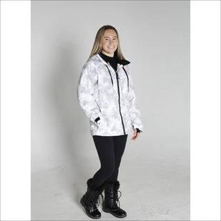 Woman wearing a white camouflage Snow Country outerwear winter ski coat