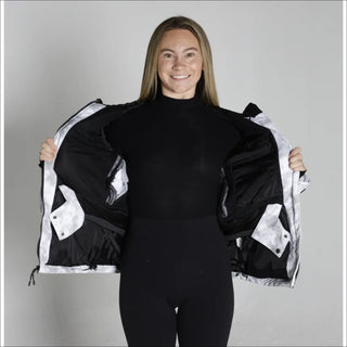 Woman showing the inside of a White and Black Snow Country Womens Ski Coat Jacket