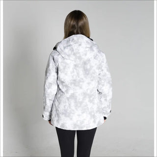 Woman wearing a white and gray camouflage Snow Country Women’s ski coat for winter snowboarding
