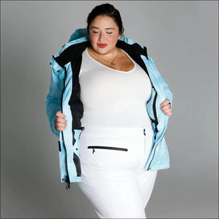 Woman in light blue insulated winter snow ski jacket for plus size outdoor winter wear