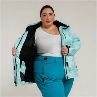 Woman in teal ski suit wearing Women’s Plus Size 1X-4X Insulated Winter Snow Ski Jacket
