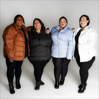 Four women wearing snowy puffer jackets from Snow Country Outerwear Lexington collection