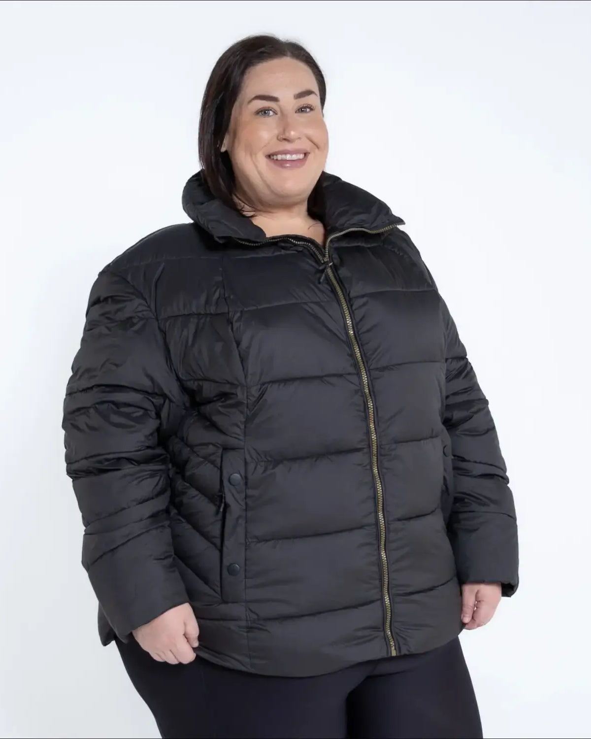 Black puffer jacket from Snow Country Outerwear Women’s Plus Size Lexington synthetic winter coat