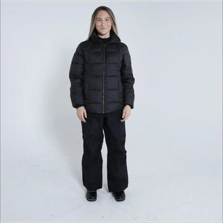Woman in black puffer jacket and pants wearing Snow Country Outerwear Lexington Puffy Jacket