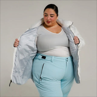 Woman in ski attire wearing Snow Country Outerwear Women’s Plus Size Puffy Winter Jacket