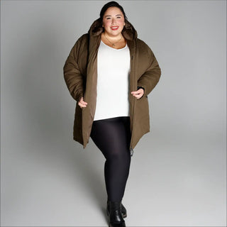 Woman wearing a puffy olive-green plus size insulated winter parka coat