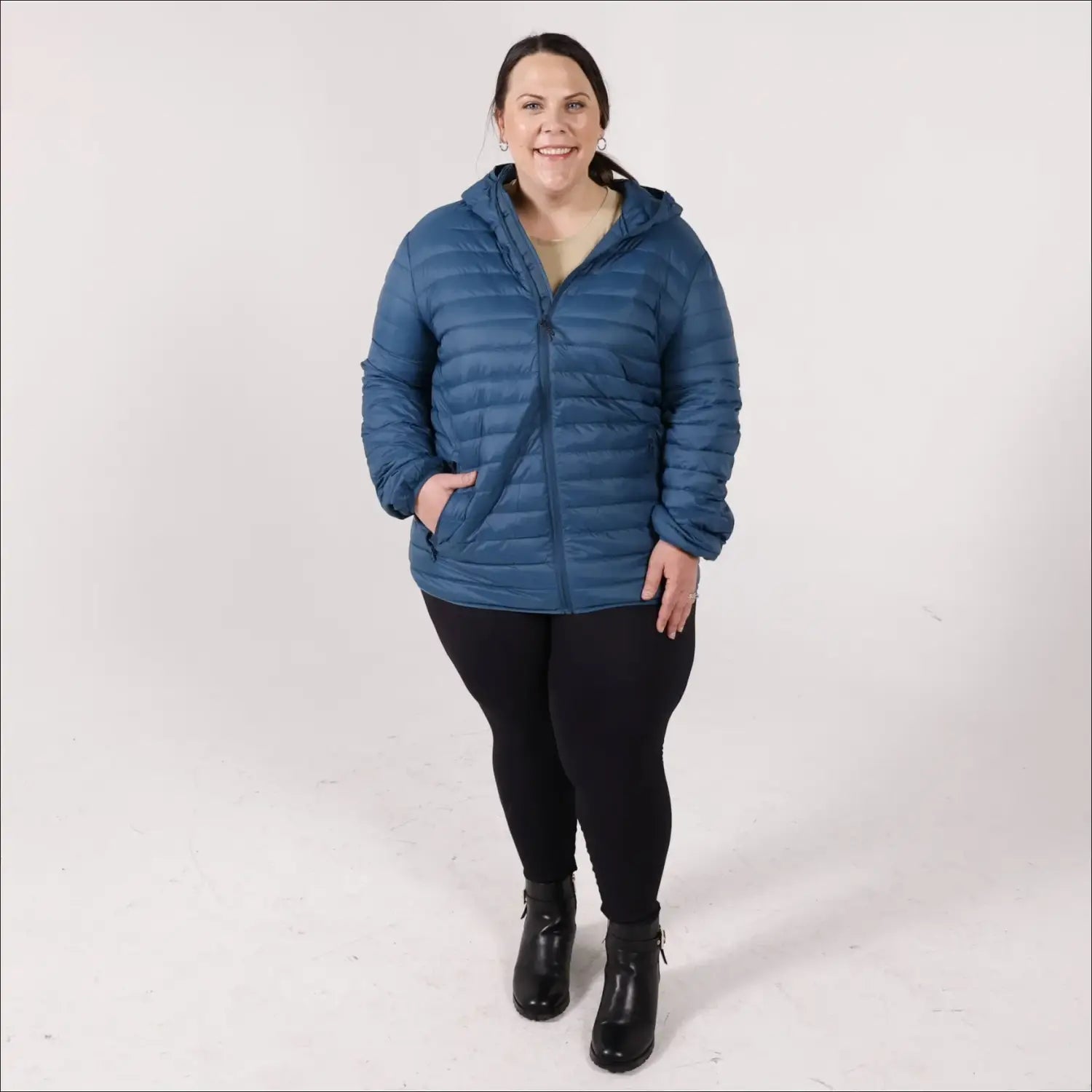Woman in blue puffer jacket wearing Women’s 1X-6X Plus Extended Size Packable Down Jacket Hooded Coat Snow Country Outerwear