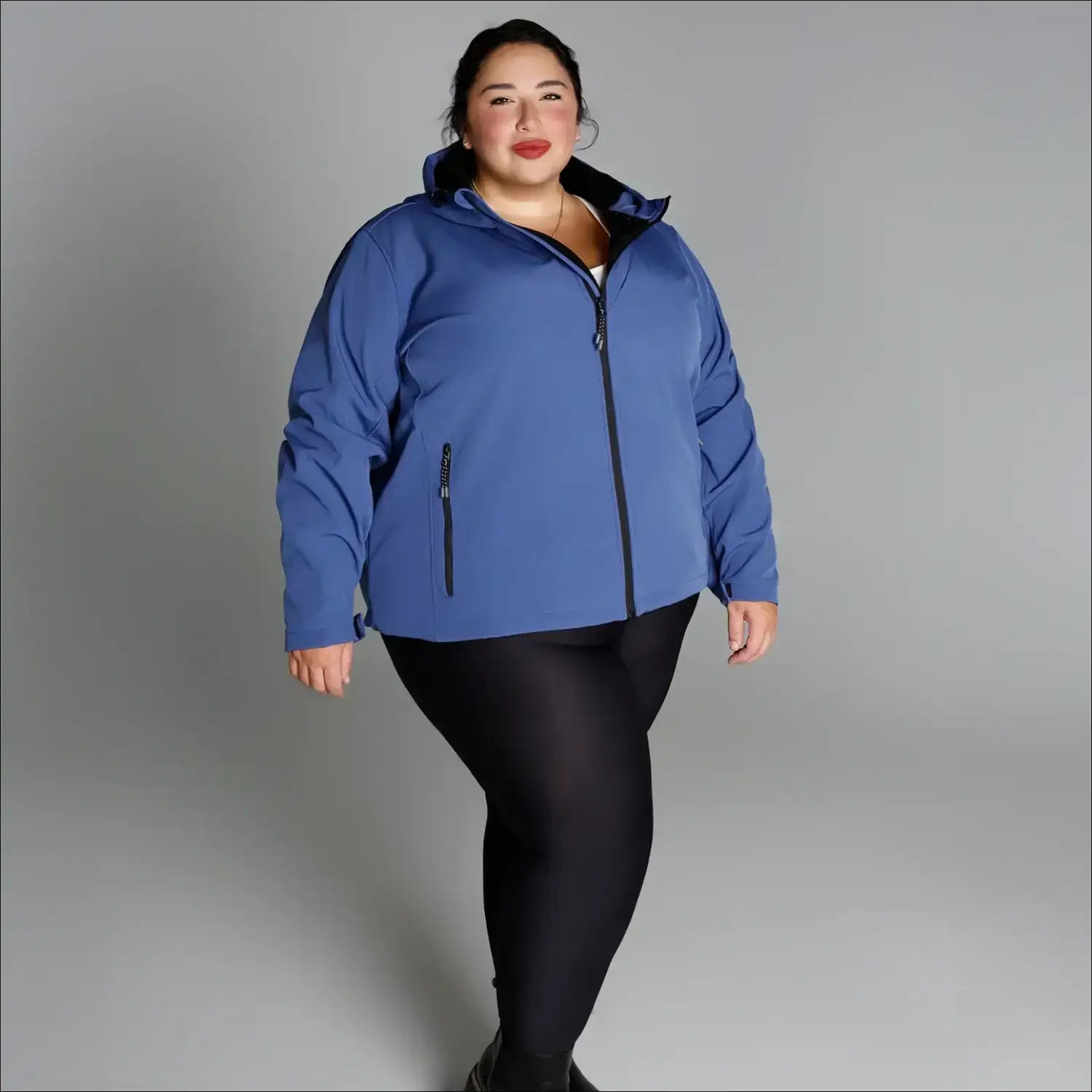 Woman in blue hooded jacket and black leggings wearing plus size Micro Fleece Soft Shell outerwear