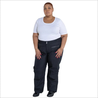 Woman in black snow pants and white t-shirt wearing Plus Size Trax Winter Ski Pants