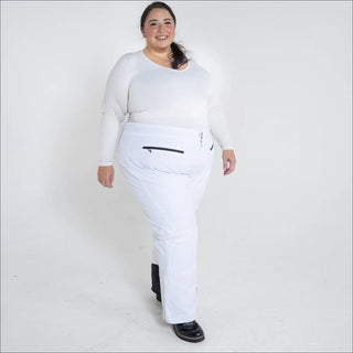 Woman in white plus size insulated ski pants and top for winter snow sports