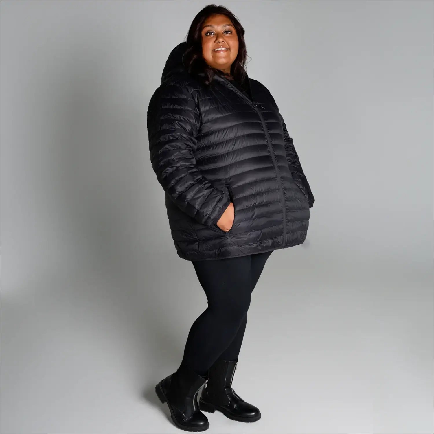Black hooded puffer jacket for women in extended plus sizes, packable winter coat