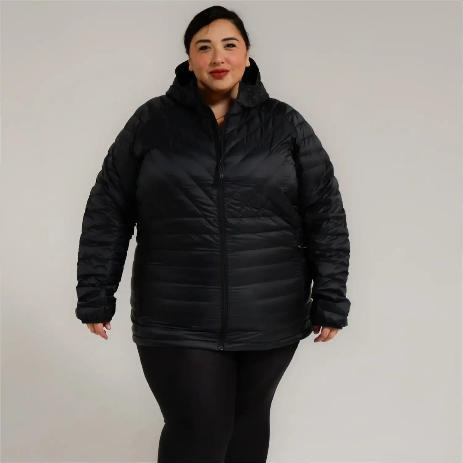 Black hooded puffer jacket from Women’s Plus Extended Size Packable Down Jacket collection