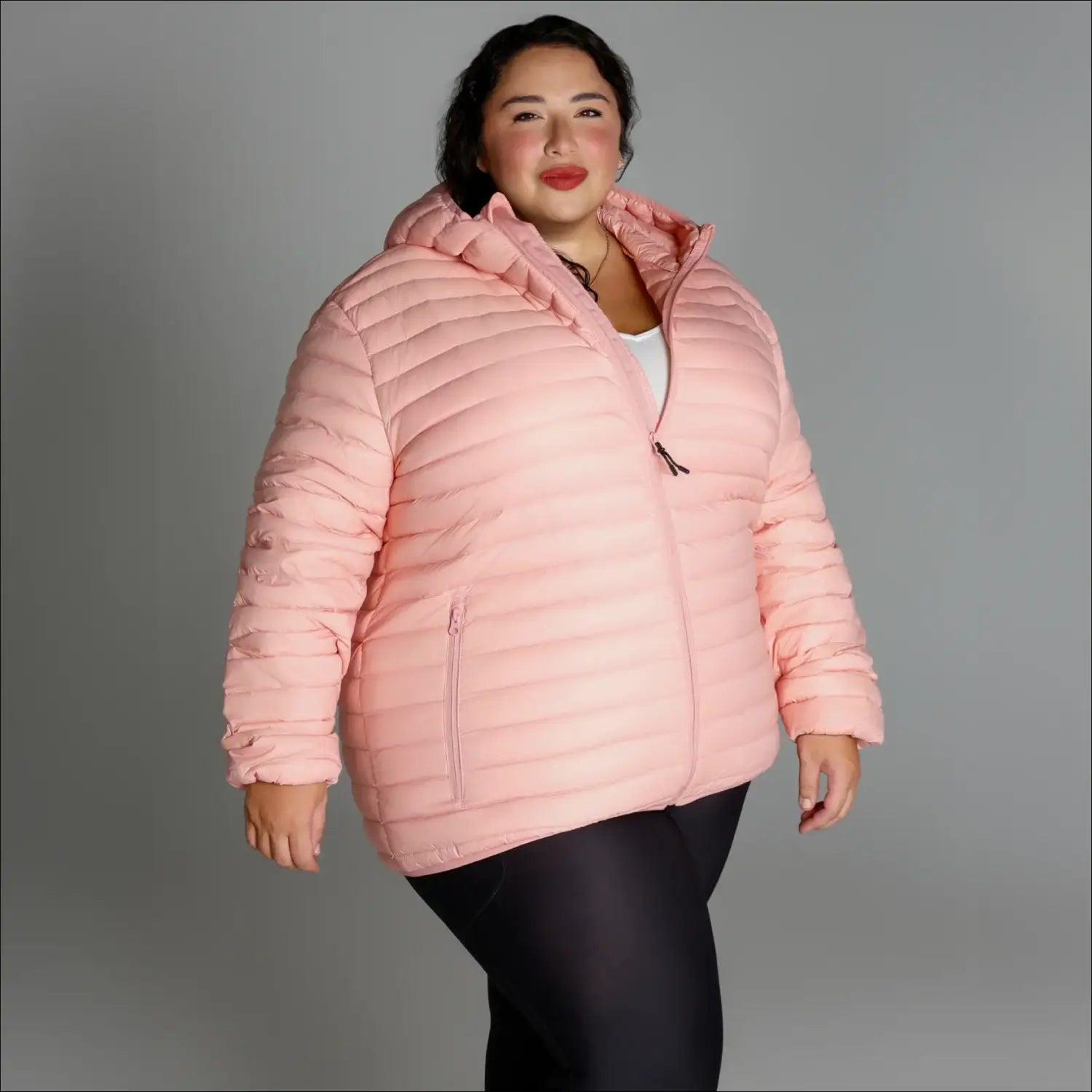 Pink hooded puffer jacket in women’s plus size packable down snow country outerwear