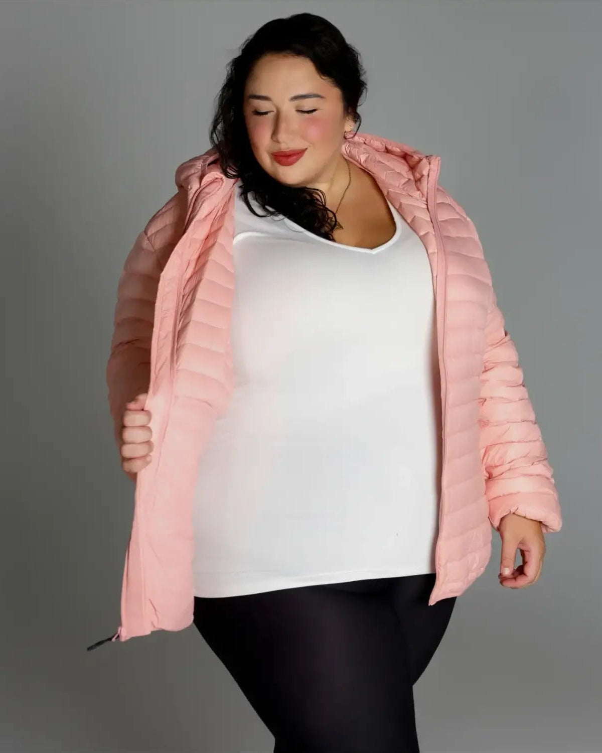 Woman in pink puffer jacket showcasing Women’s 1X-6X Plus Packable Down Coat Outerwear