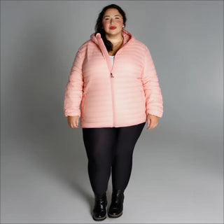 Woman wearing a pink puffer jacket from the Women’s Plus Extended Size Packable Down Coat collection