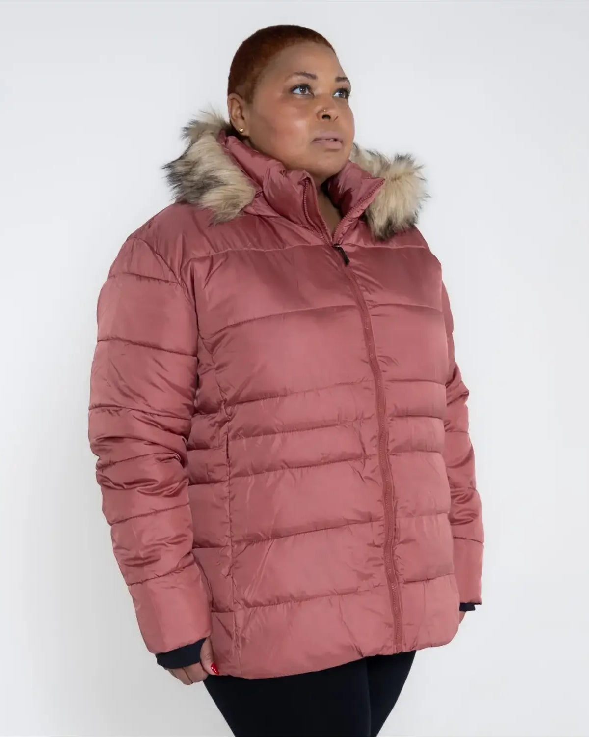 Rose-colored puffer jacket with fur-trimmed hood from Snow Country Outerwear Luna Plus Size Ski Coat