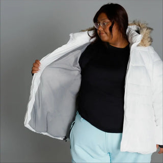 White puffer jacket with fur trim from Snow Country Outerwear Women’s Plus Size Ski Coat