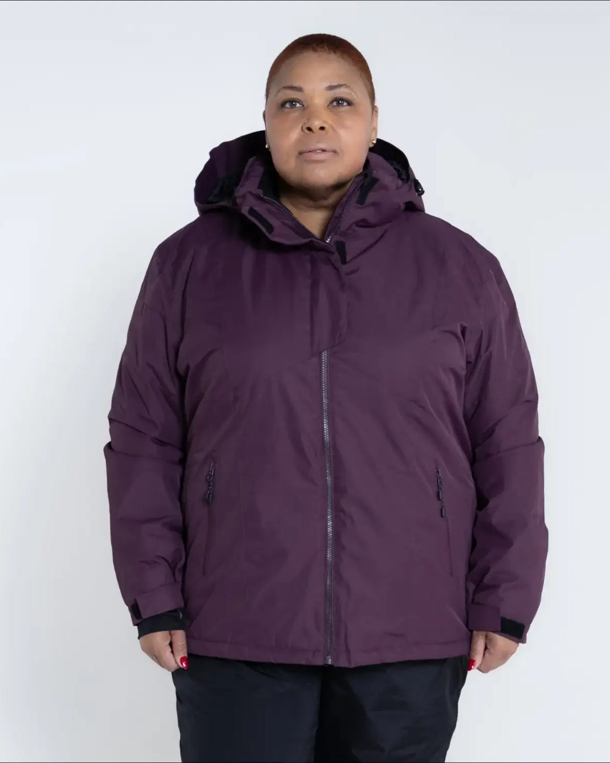 Plum-colored hooded winter jacket from Snow Country Outerwear Women’s Plus Size Ski Coat
