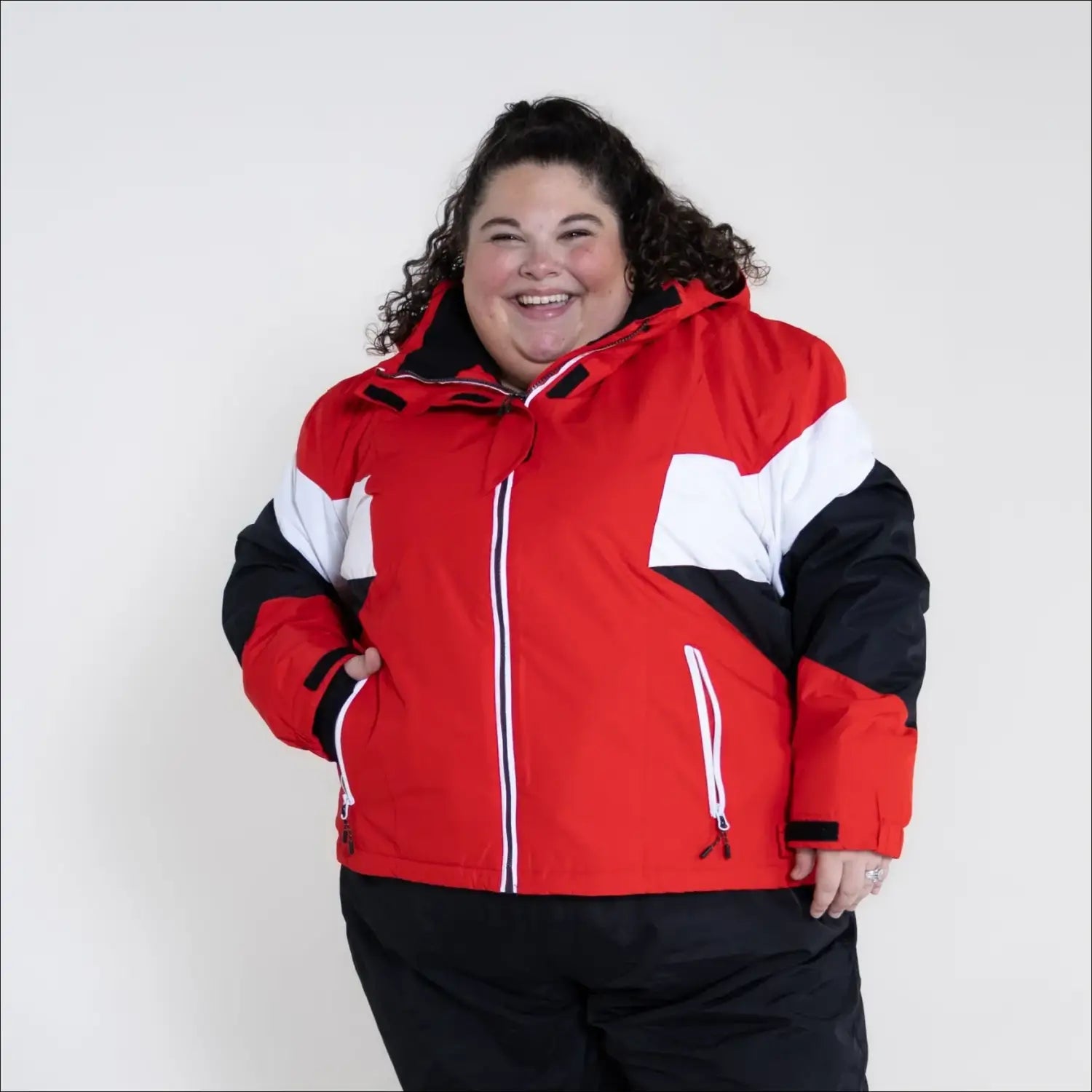 Red, white, and black insulated ski jacket from Snow Country Outerwear for women