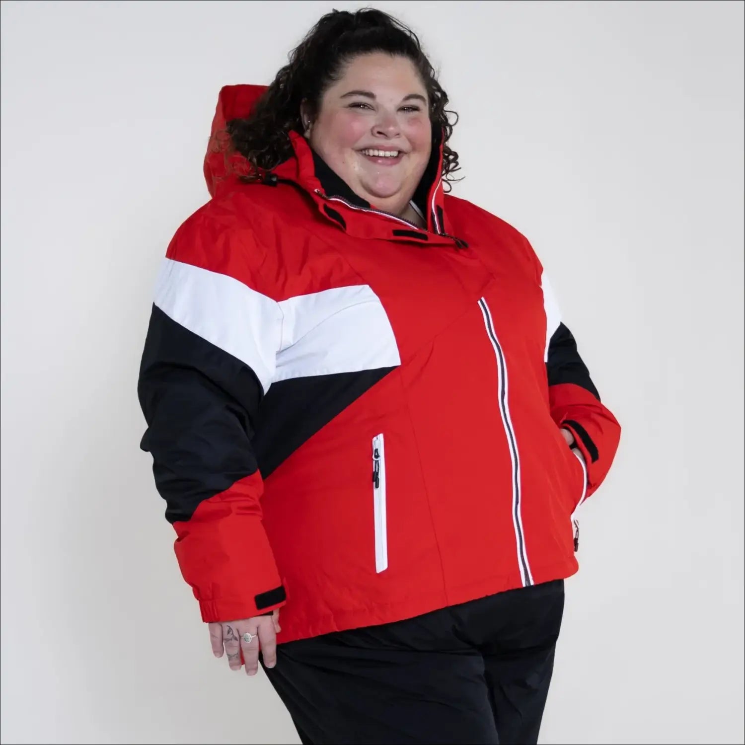 Red, white, and black insulated women’s plus size ski jacket from Snow Country Outerwear