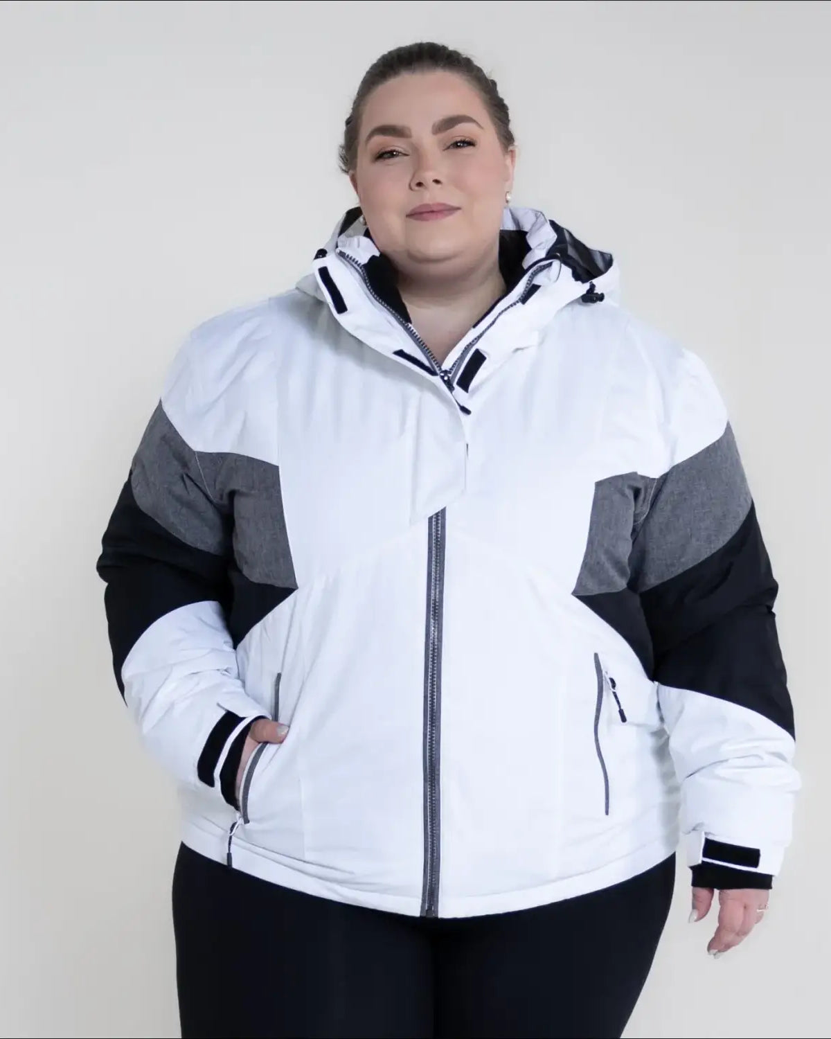 White, gray, and black hooded winter jacket from Snow Country Outerwear Plus Size Ski Coat