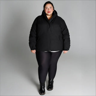 Woman wearing black puffer jacket from Snow Country Outerwear Fortress Winter Snow Ski Coat