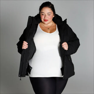 Woman in black puffer jacket from Snow Country Outerwear Plus Size Fortress winter coat