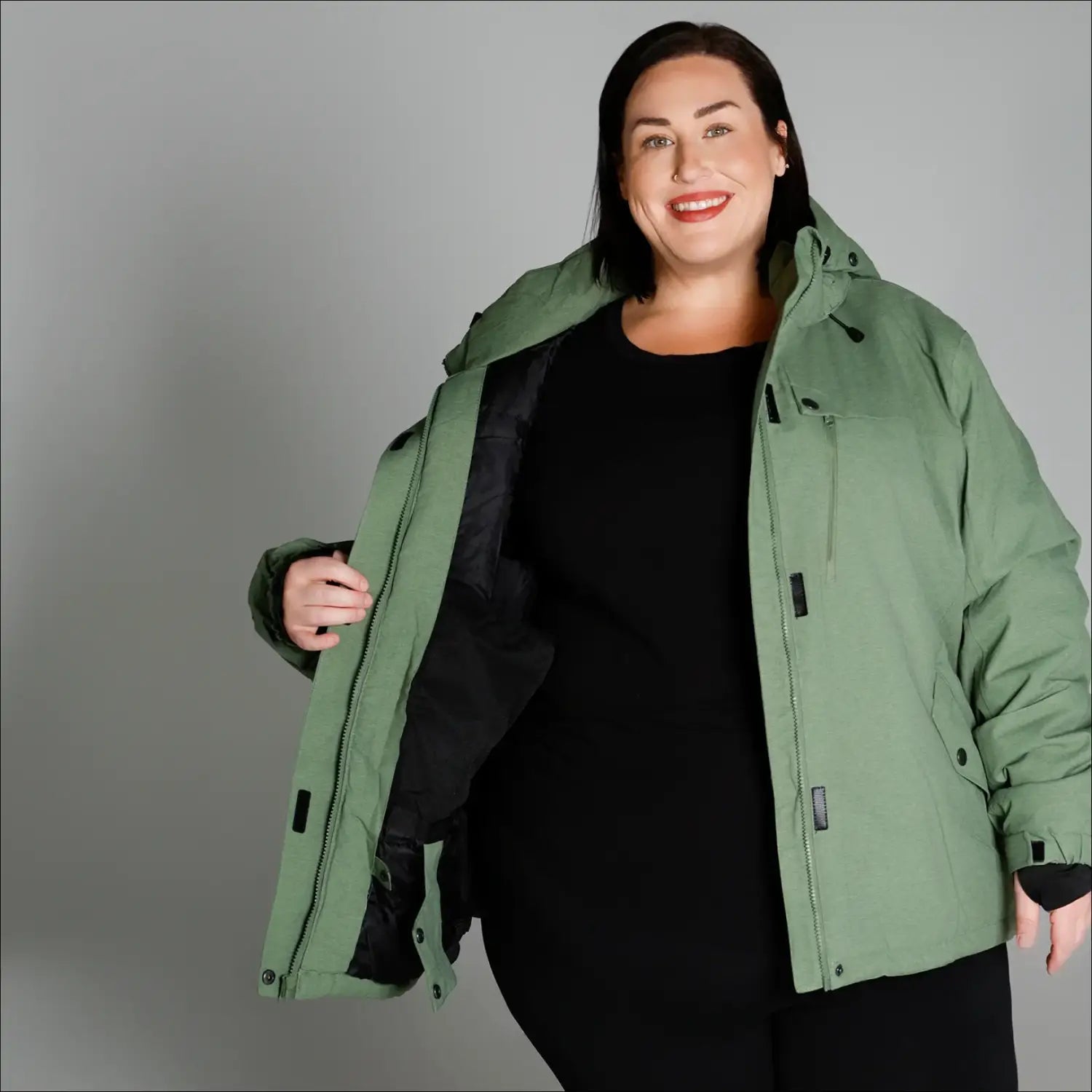 Sage green hooded winter jacket from Snow Country Outerwear Women’s Plus Size Fortress collection