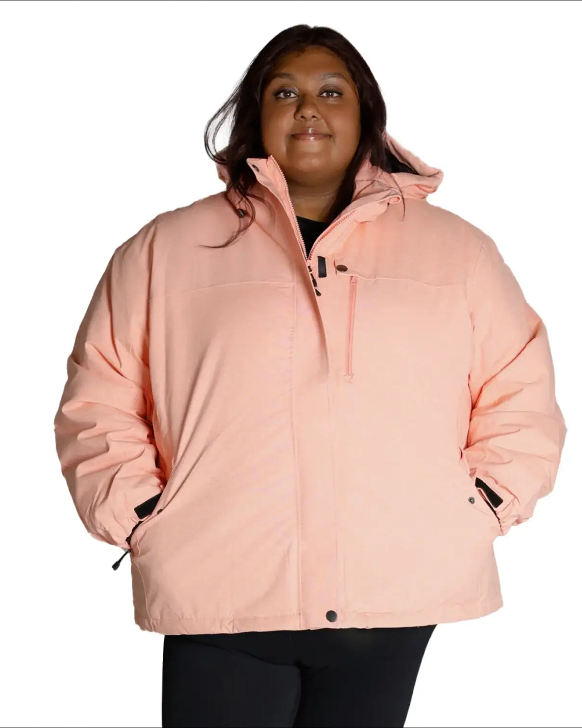 Woman wearing a pink puffer jacket from Snow Country Outerwear Fortress Plus Size Ski Coat