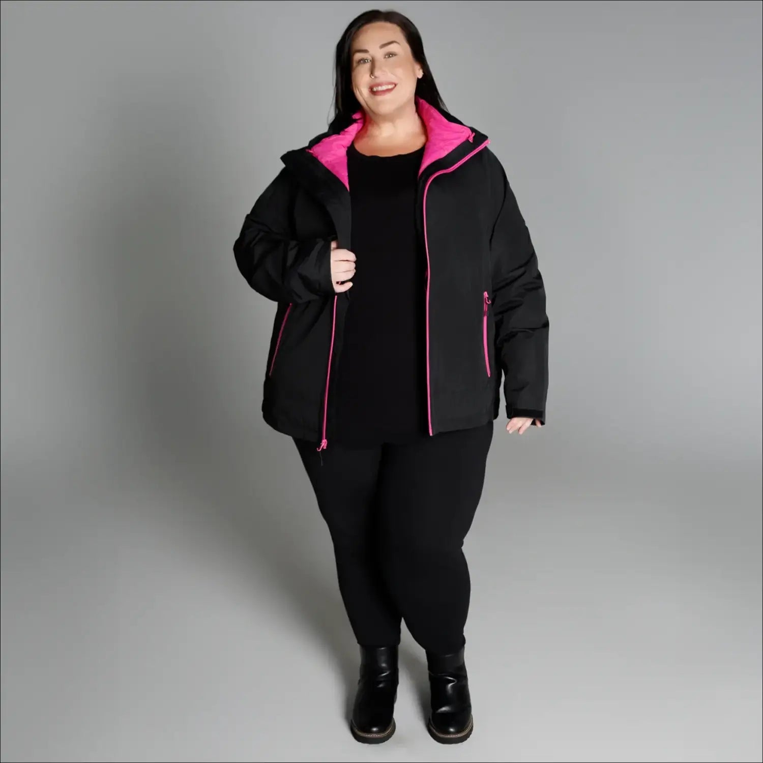 Woman wearing black and pink winter down alternative 3-in-1 coat jacket snow country outerwear