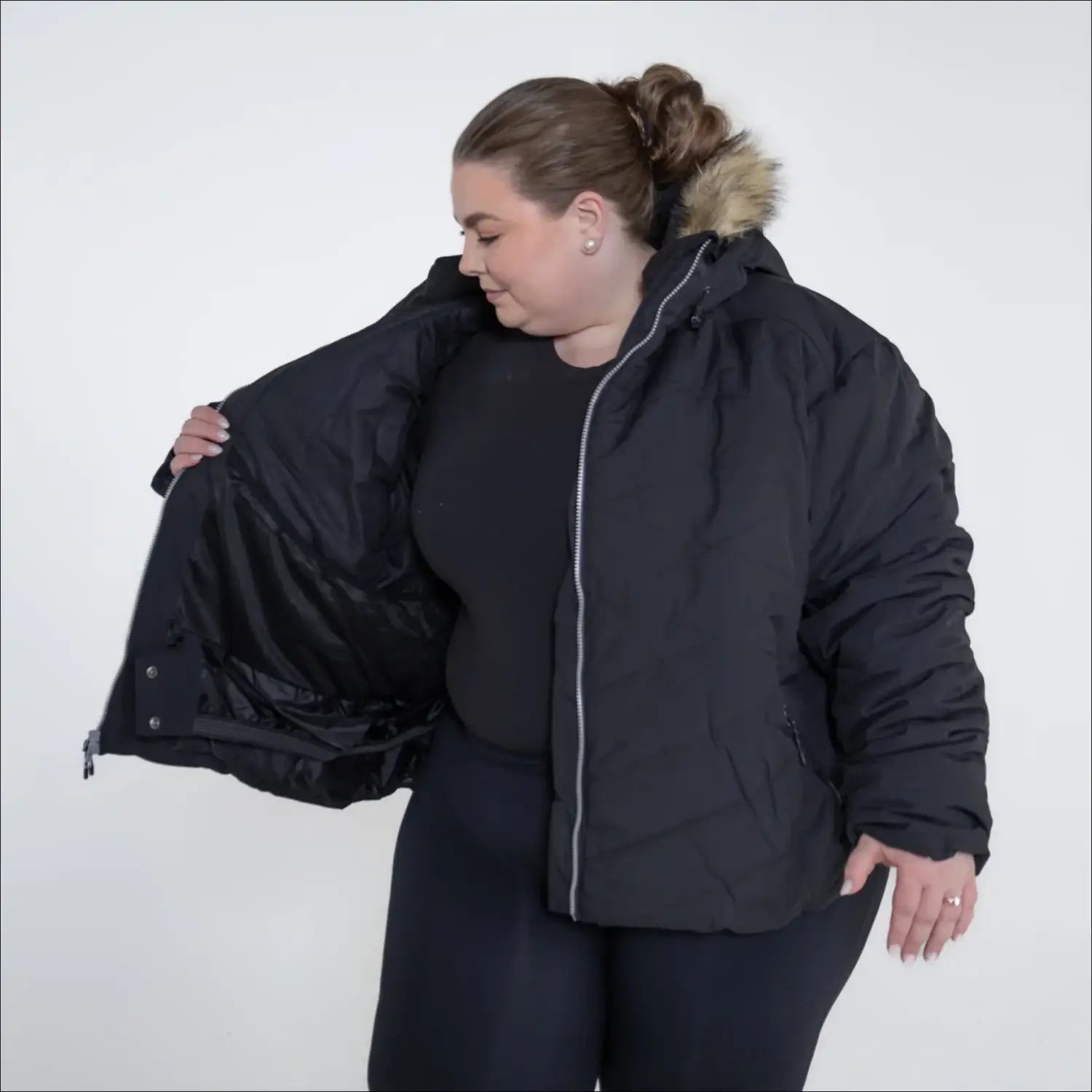 Black puffer jacket with fur-trimmed hood from Snow Country Outerwear Vail Ski Coat