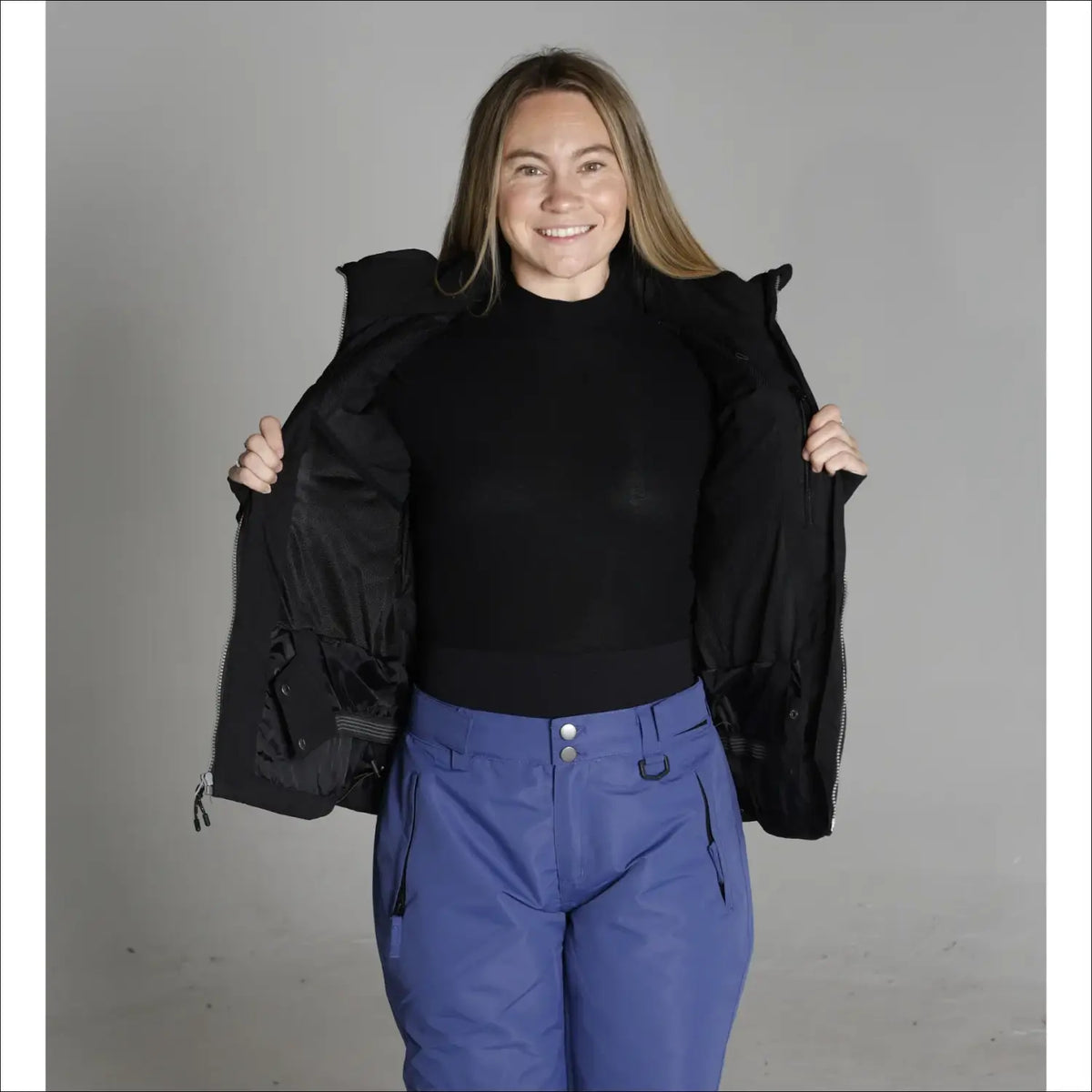 Woman wearing Snow Country Outerwear Vail Down Alternative Winter Ski Jacket