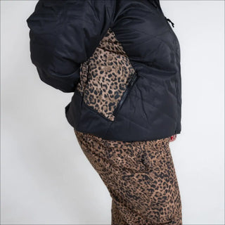 Plus size black puffer jacket with leopard print accents for winter snow skiing