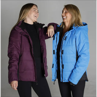 Two women wearing Snow Country Outerwear Women’s Aspen S-XL insulated winter snow ski jackets