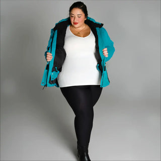 Woman wearing a teal Snow Country Outerwear Womens Aspen Ski Jacket Coat