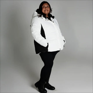 Woman wearing Snow Country Outerwear Womens Aspen Ski Jacket Coat in white and black