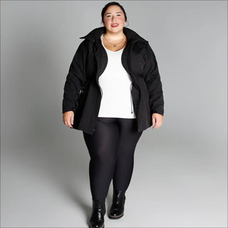 Woman in black jacket and leggings showcasing Women’s Plus Size Stowe Soft Shell Jacket